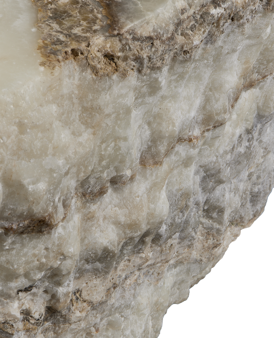 Close-up of the vintage Indonesian onyx slab's rough, natural edge texture.