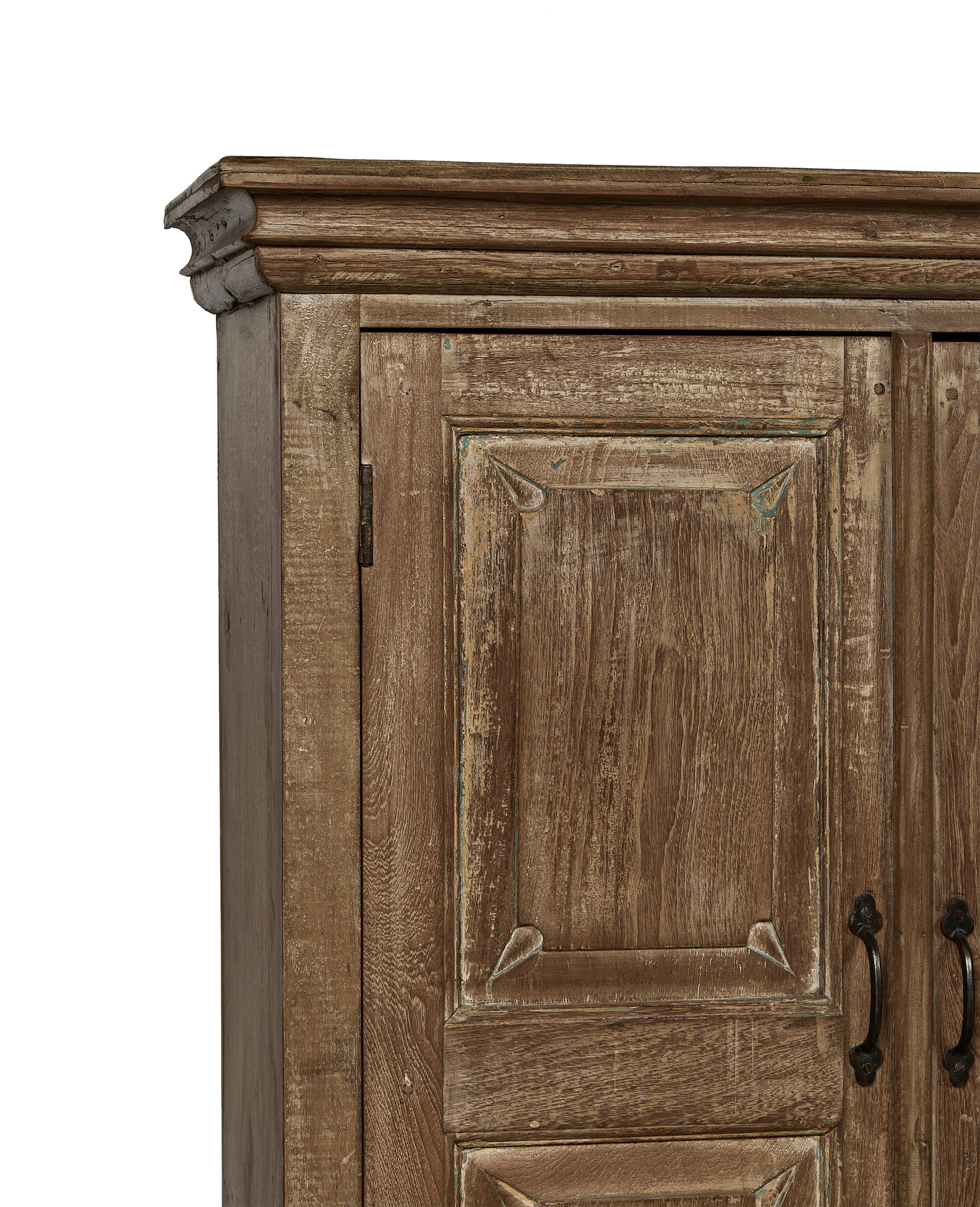 Vintage Indian oak cabinet: detailed close-up of decorative carved top molding and distressed wood finish.