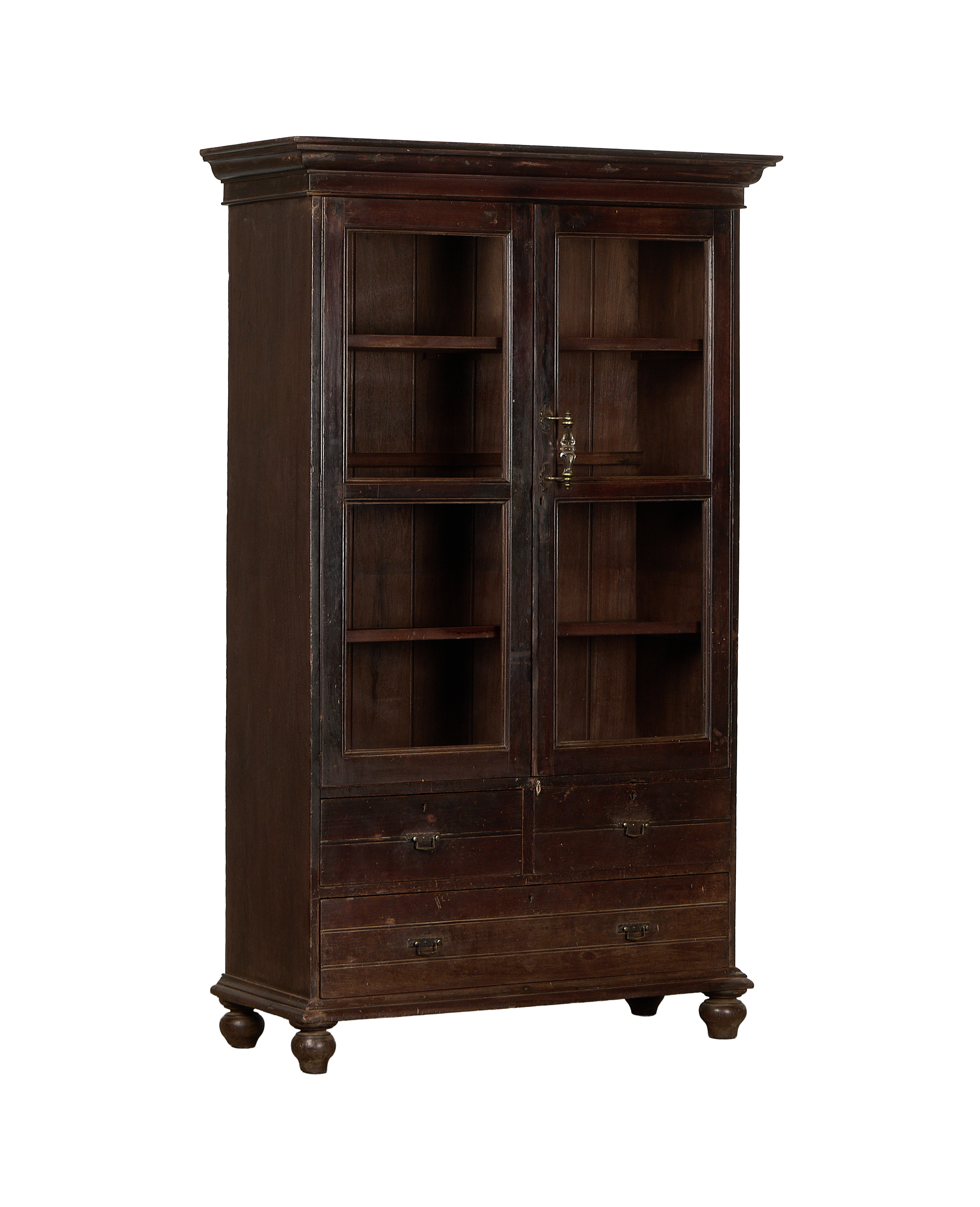Vintage Indian oak wood display cabinet, glass doors, brass hardware, and lower drawers.
