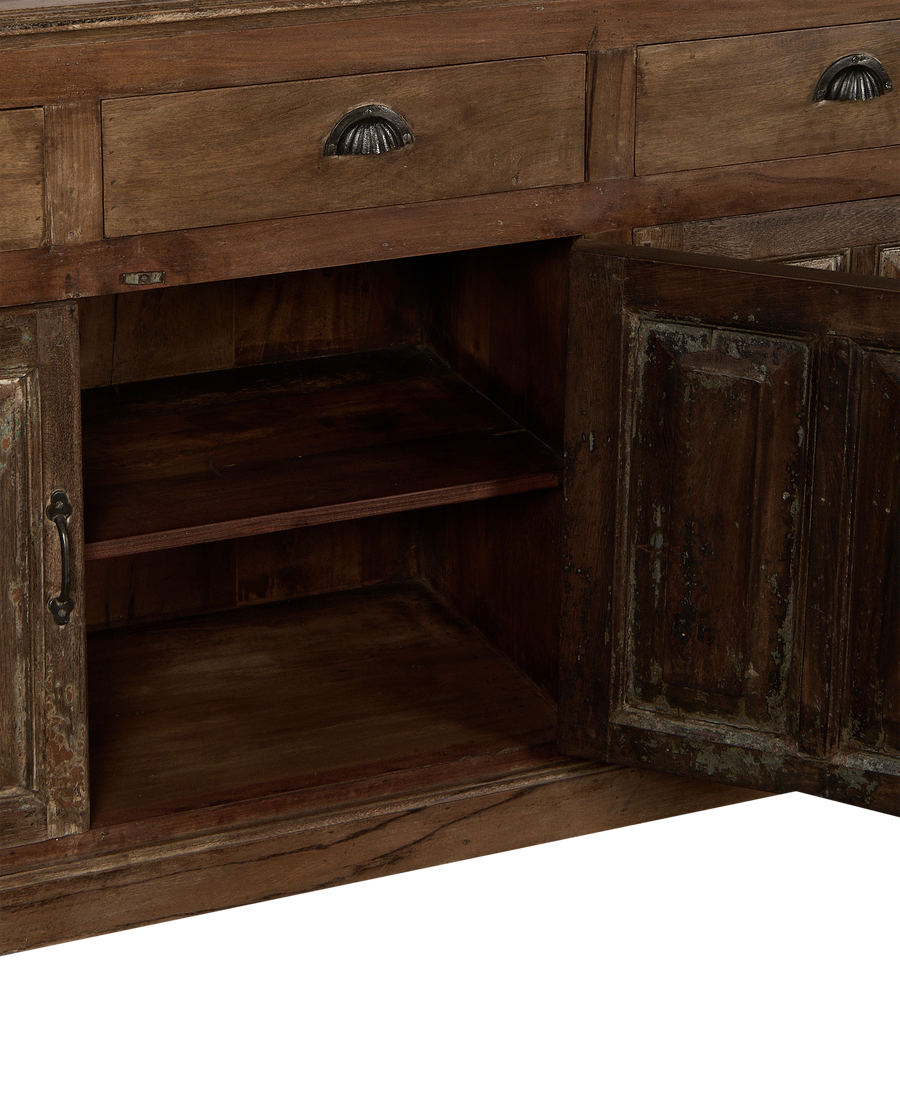 Opened vintage Indian oak cabinet showing natural wood interior shelves and distressed texture.