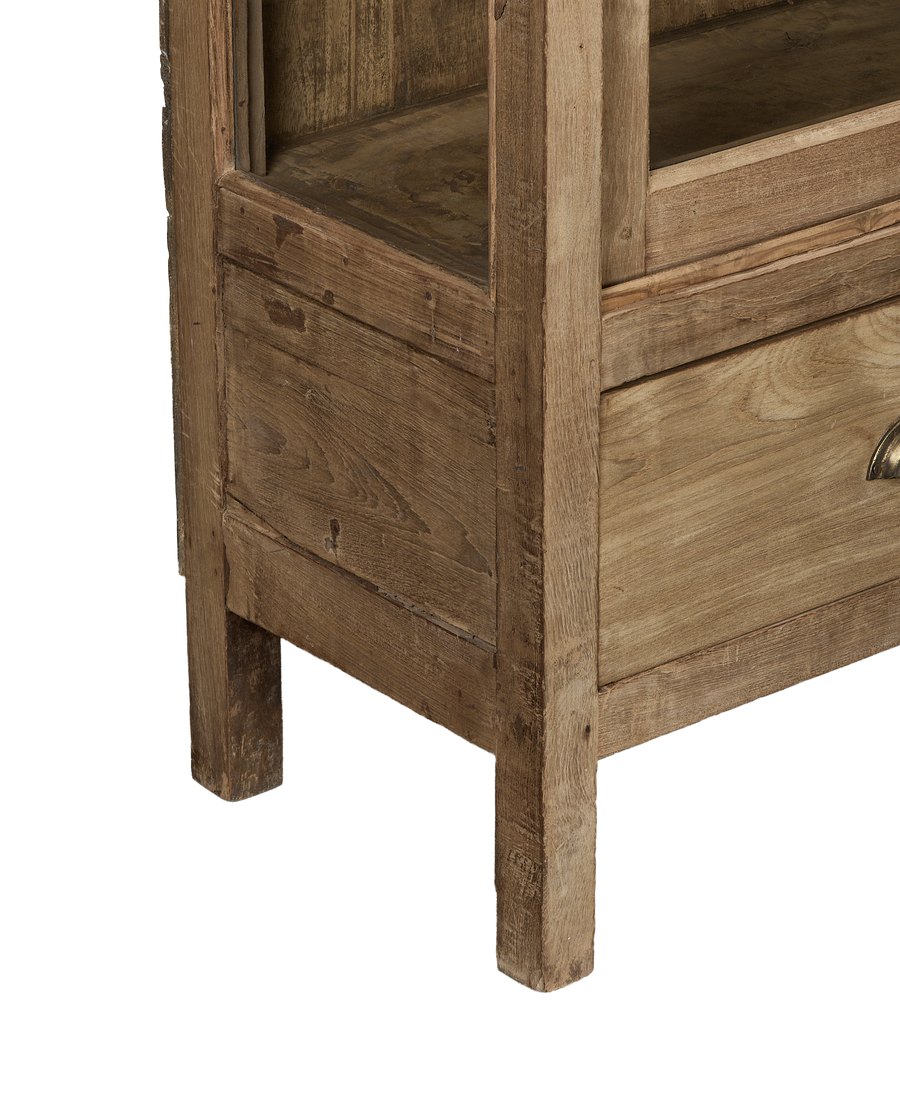 Vintage Indian bleached oak cabinet's lower weathered frame, drawer detail, and sturdy foot.