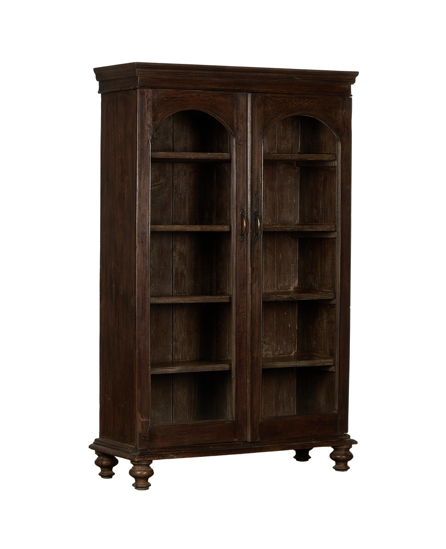 Vintage Indian oak display cabinet with visible glass-fronted doors, interior shelving, and turned feet.