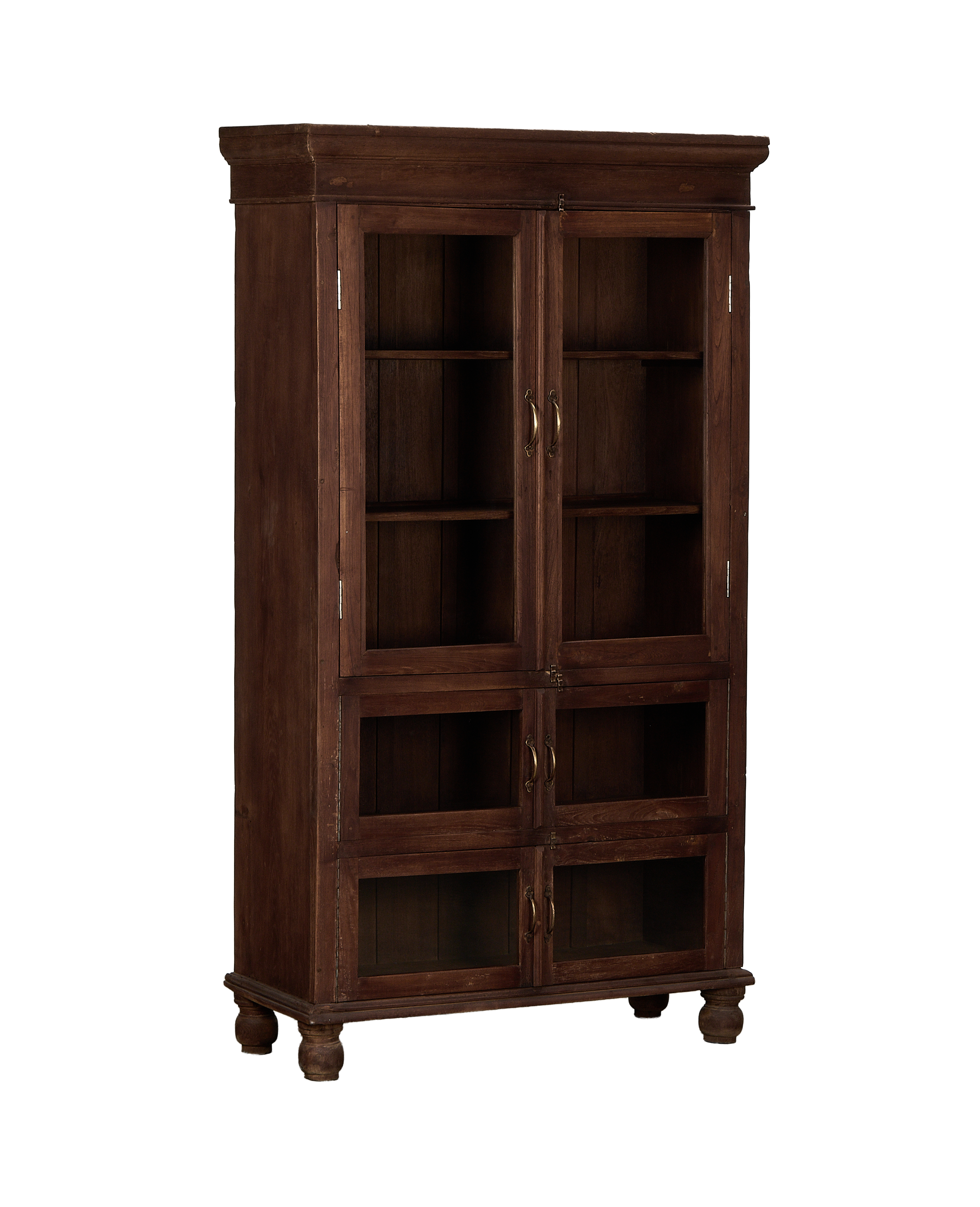 Vintage Indian bleached oak wood cabinet, frontal view detailing dark glass doors and brass pulls.