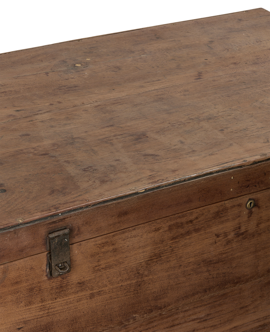 Close-up of vintage Indian oak chest, natural wood grain details, and rusted metal clasp.