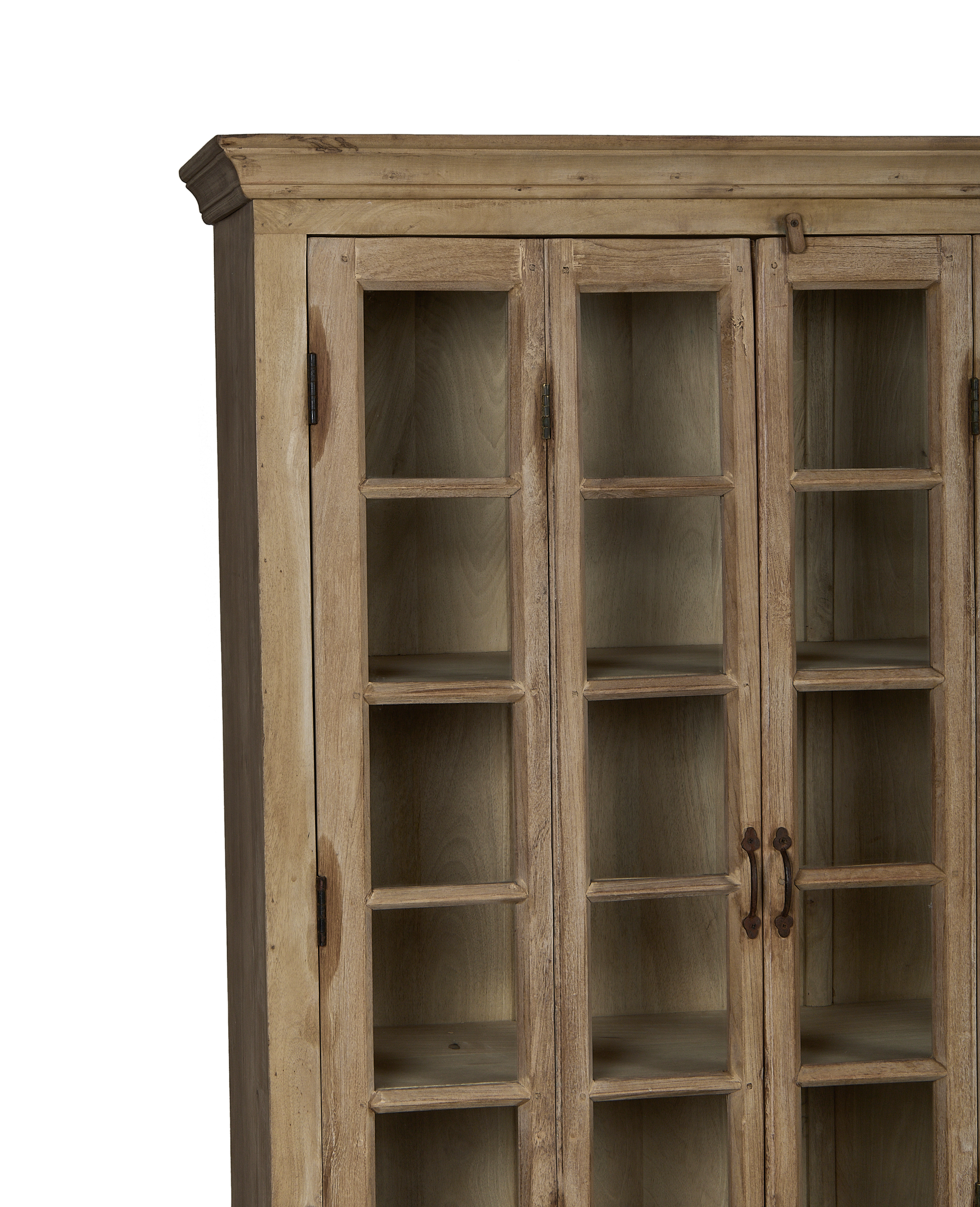 Vintage bleached oak cabinet doors with aged glass panes and original iron hardware.