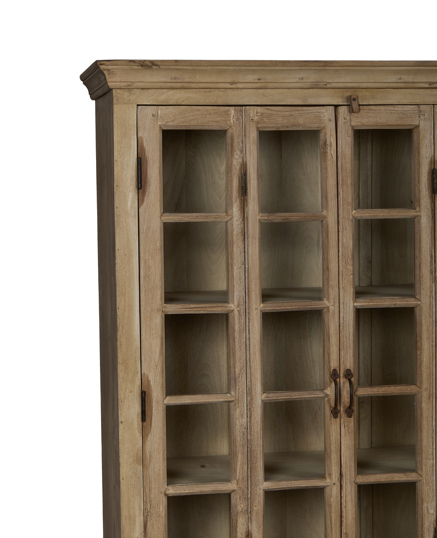 Vintage bleached oak cabinet doors with aged glass panes and original iron hardware.