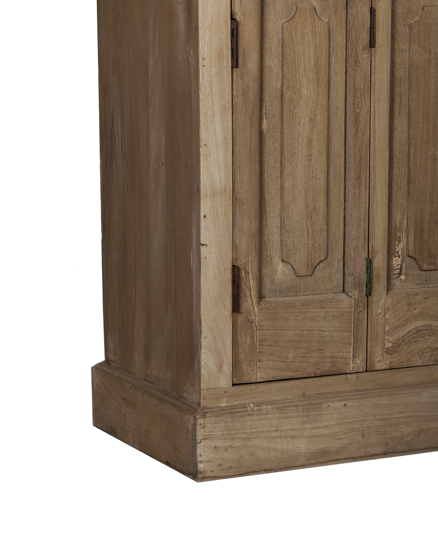 Vintage bleached oak cabinet base with weathered details and aged metal hinges.