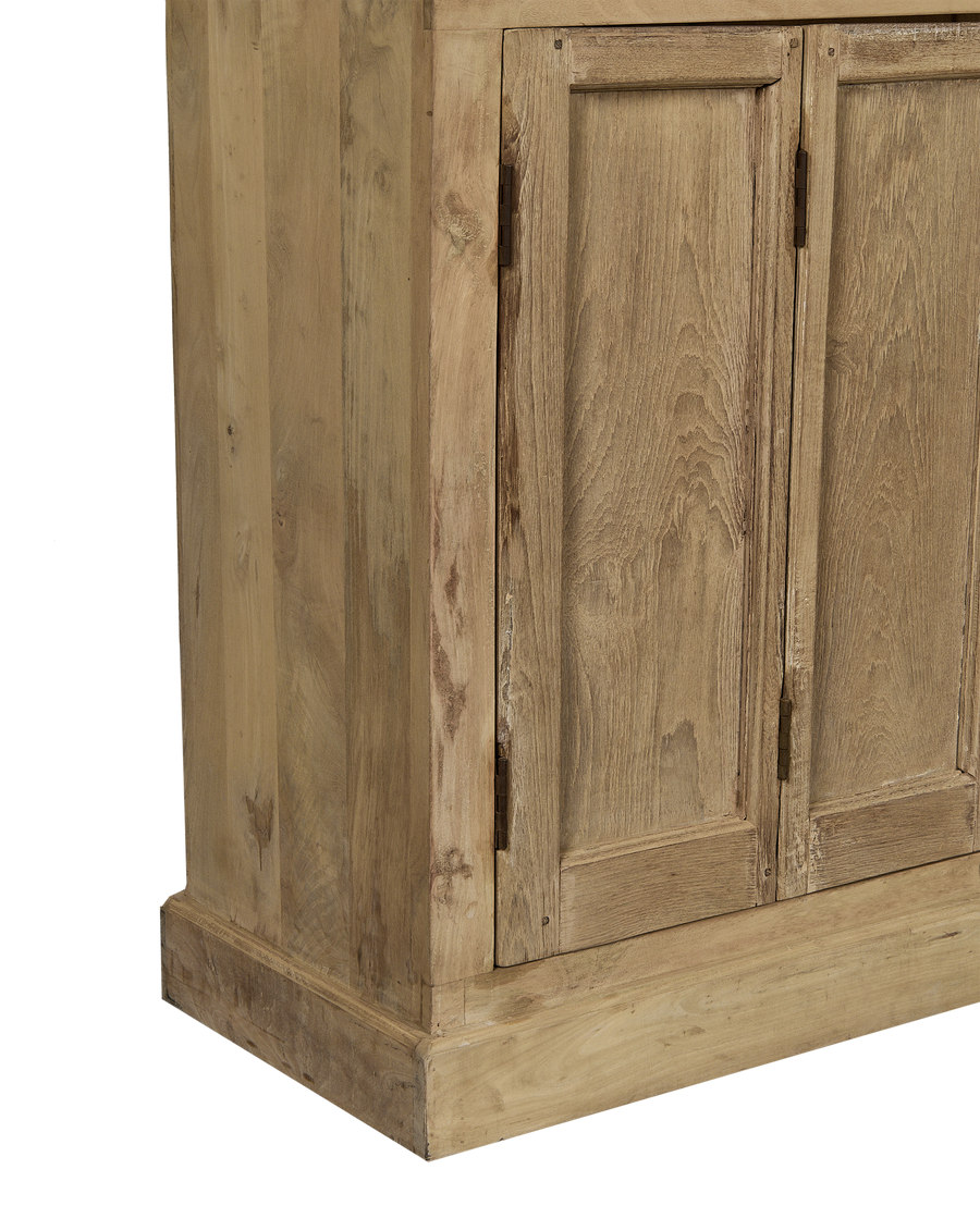 Vintage bleached oak cabinet from India, close-up showing distressed wood texture and door hinges.