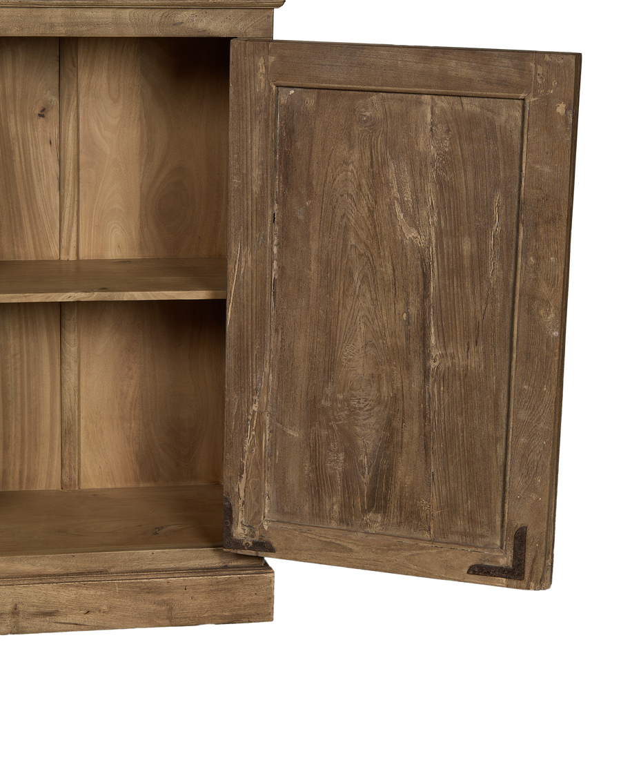 Open vintage bleached oak wood cabinet showing interior shelves and worn hinges.