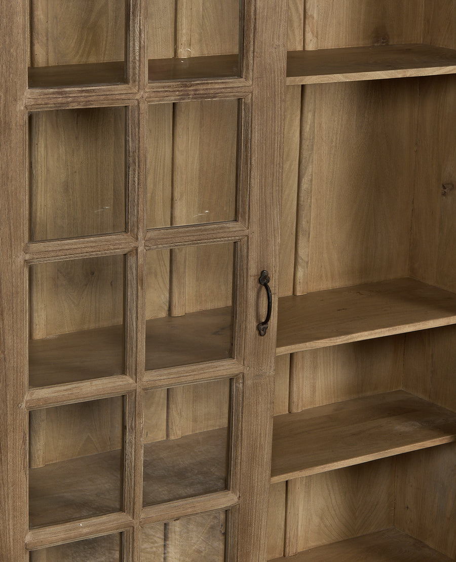Vintage bleached oak wood cabinet with glass paneled door and interior shelves.