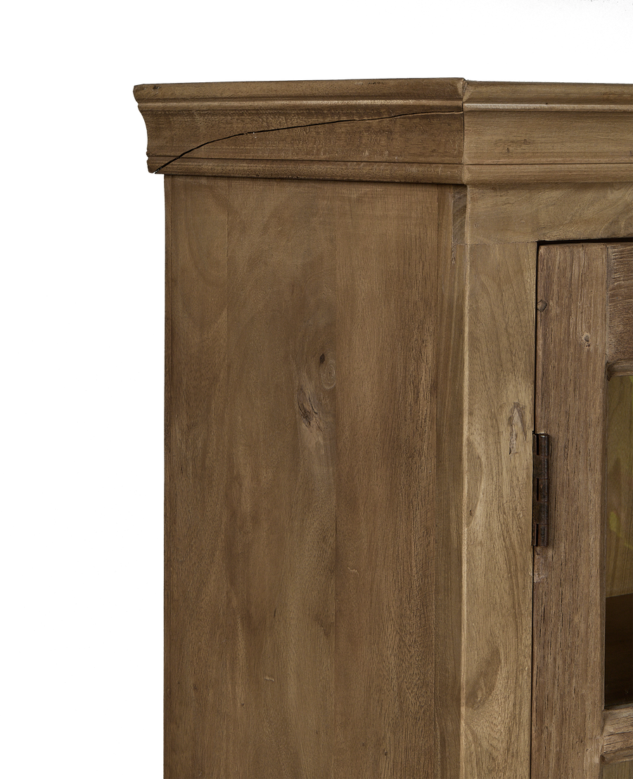 Close-up of top molding detail on vintage bleached oak cabinet from India.