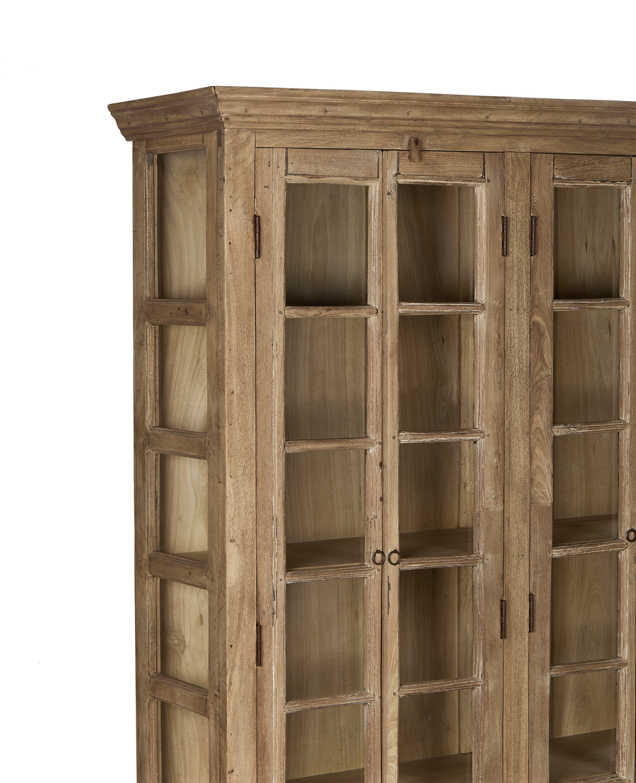Vintage bleached oak wood cabinet with glass-paned doors and distressed Indian craftsmanship.