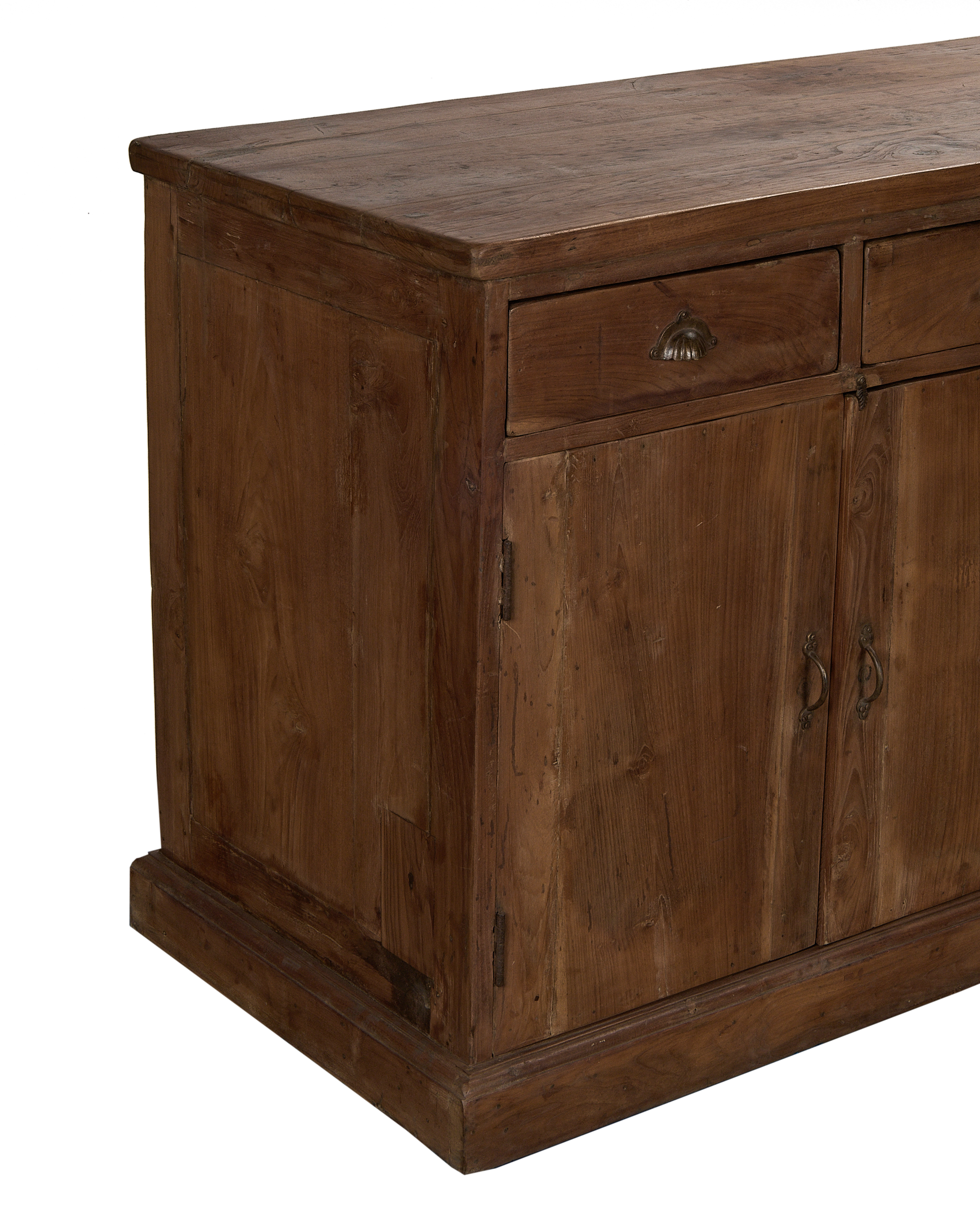 Vintage Indian oak sideboard showing richly textured wood grain, antique brass drawer pull, and detailed base.