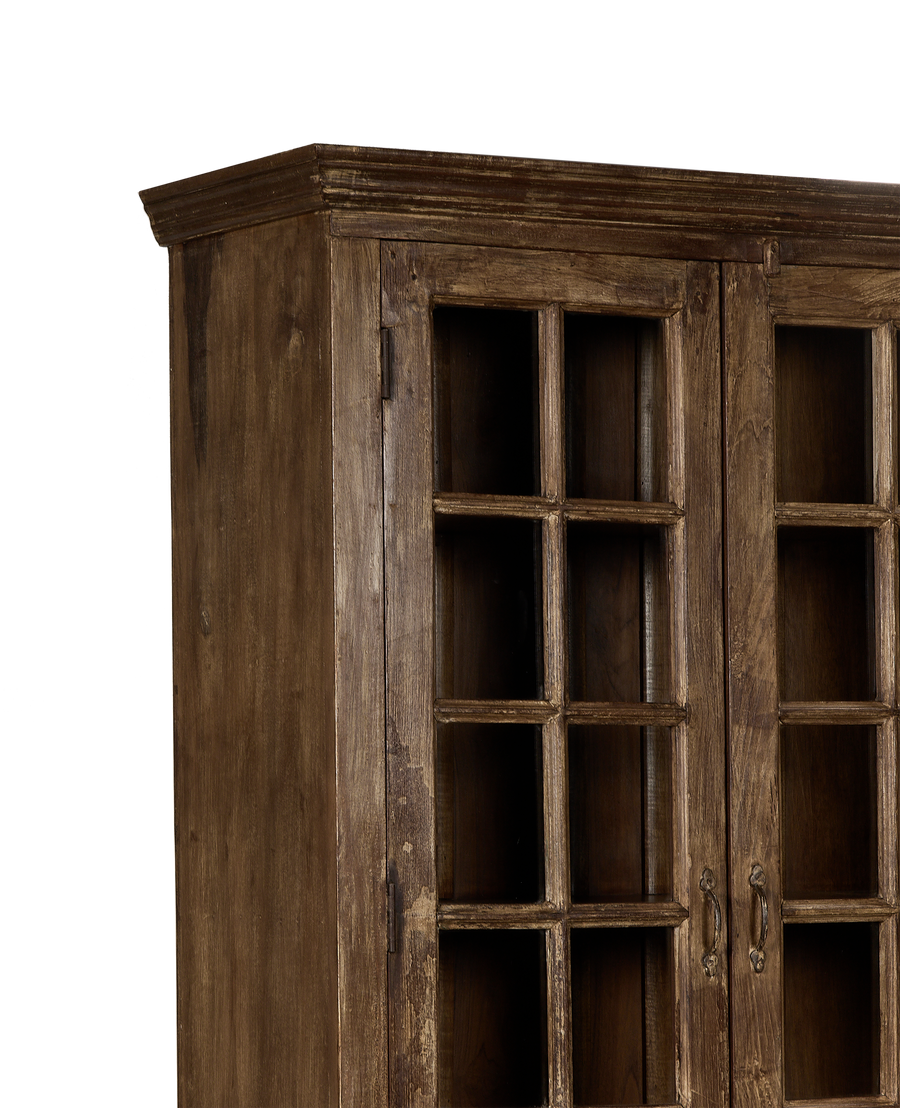 Vintage bleached oak wood cabinet with glass windowed doors and ornate metal handles.