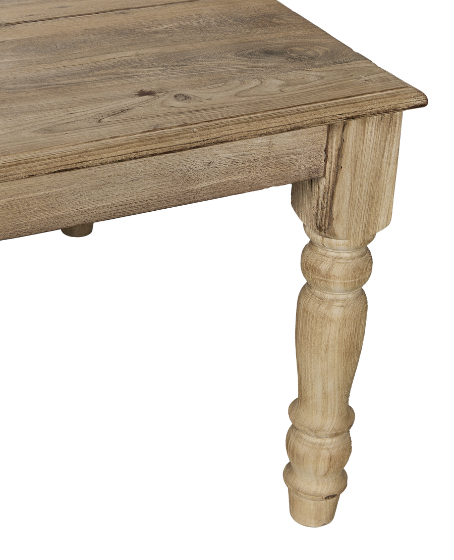 Bleached vintage Indian oak wood table, close-up of beautifully turned leg and apron.