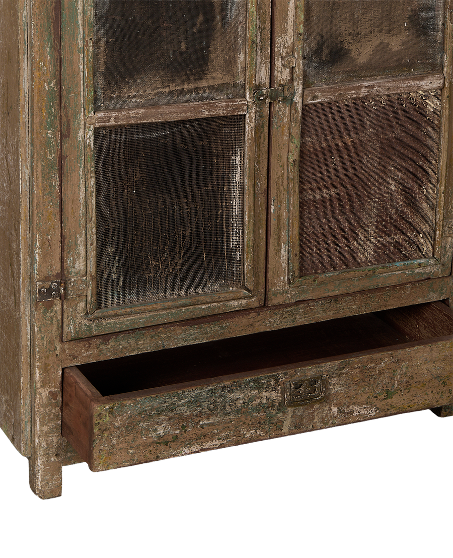 Vintage bleached oak cabinet drawer open, showing distressed paint, mesh doors, and antique hardware.