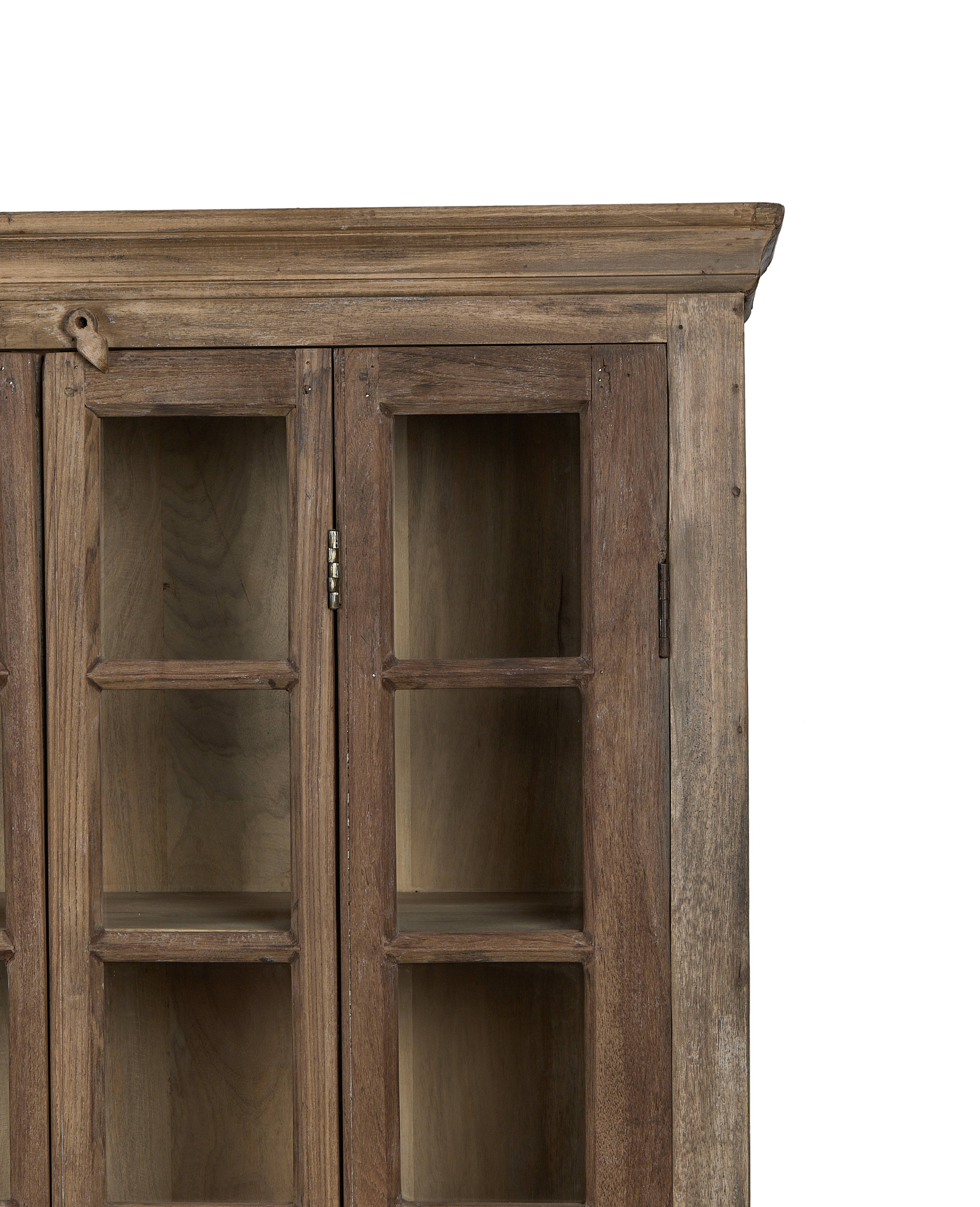 Detailed close-up: vintage bleached oak cabinet showing glass doors, wooden latch, and hinges.