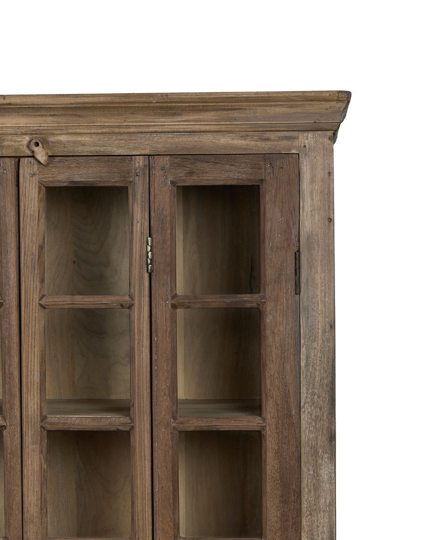 Detailed close-up: vintage bleached oak cabinet showing glass doors, wooden latch, and hinges.