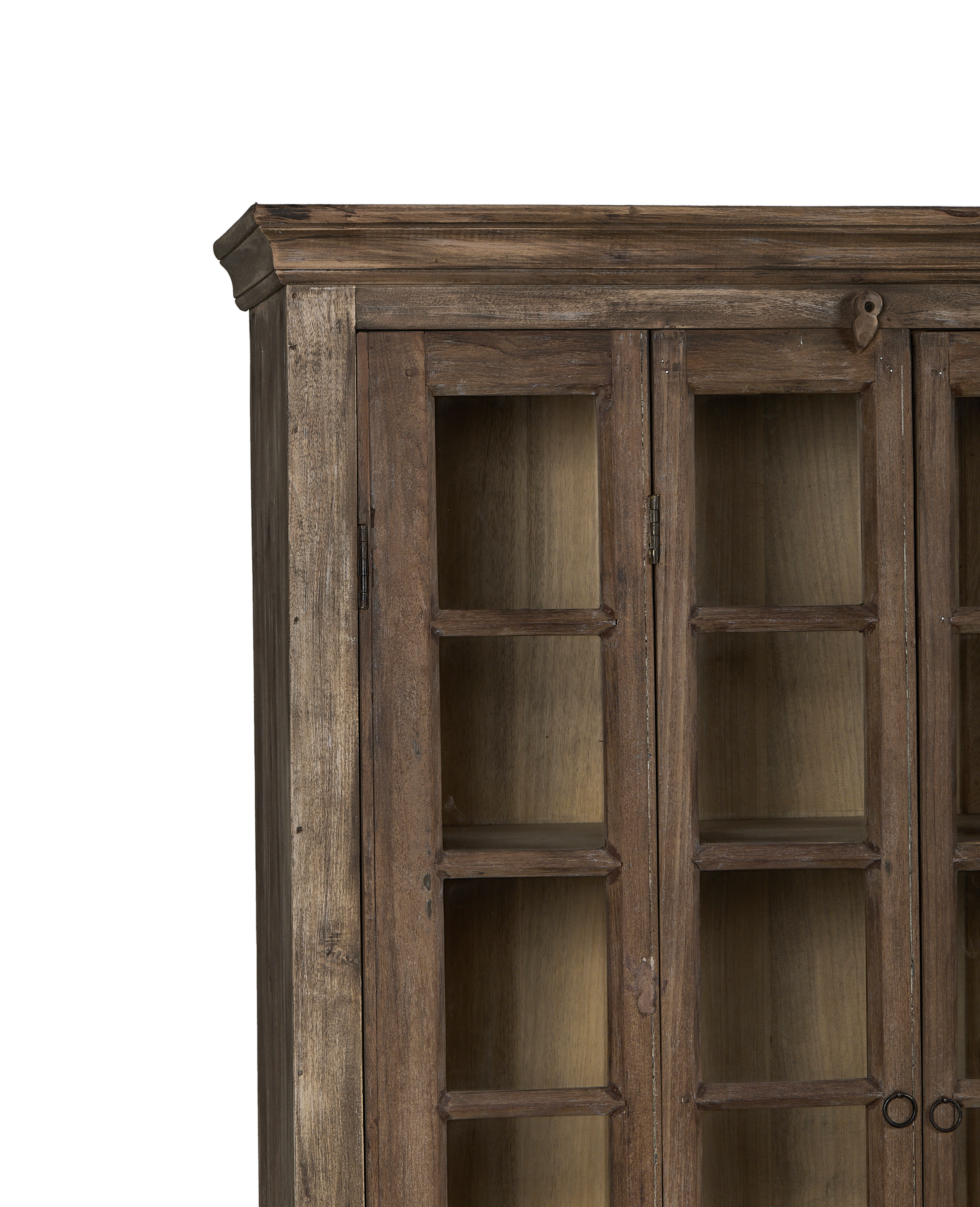 Vintage bleached oak India cabinet's top detail with visible grain and glass doors.