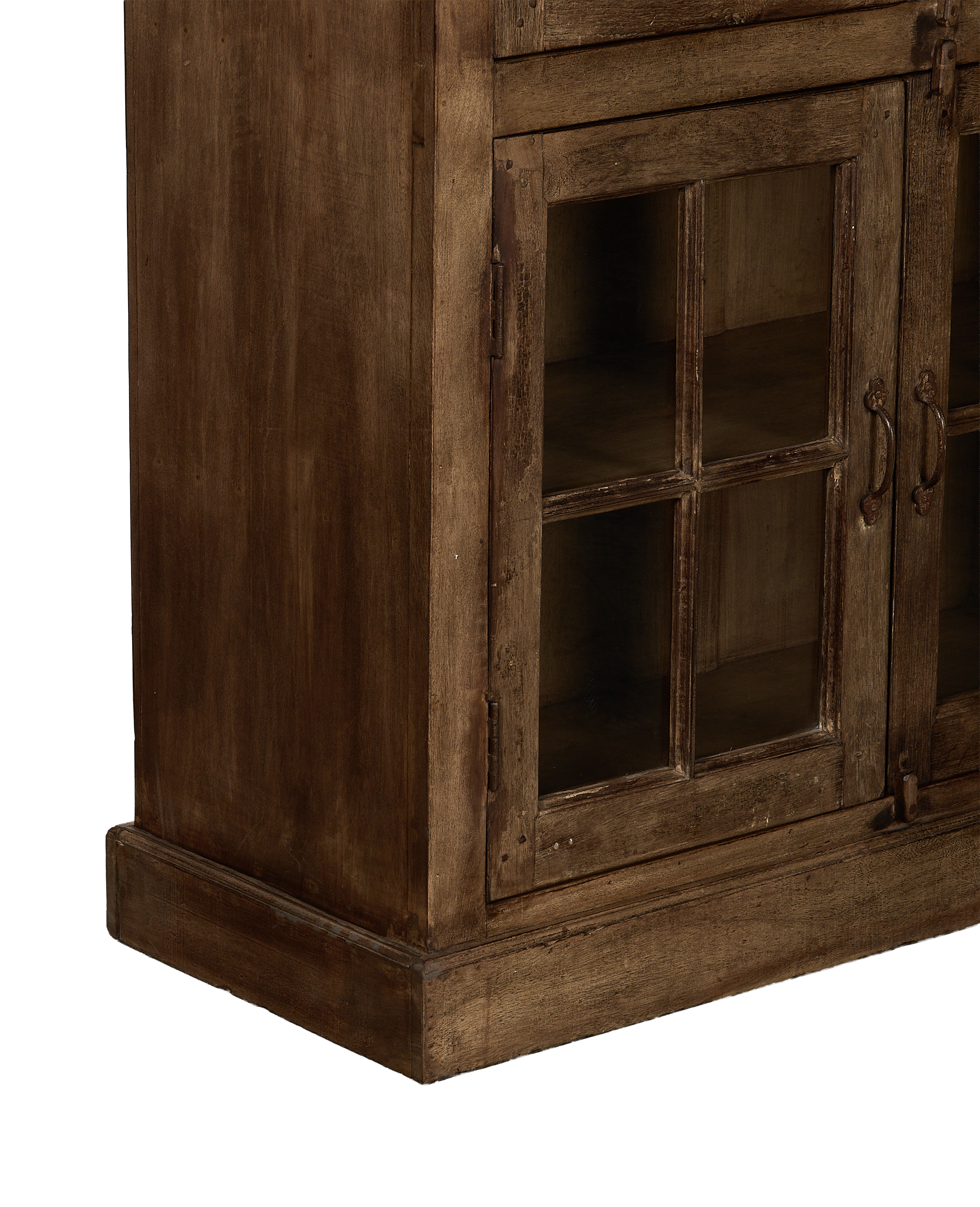 Vintage Indian oak wood cabinet, bleached finish, showing base trim and lower glass doors.