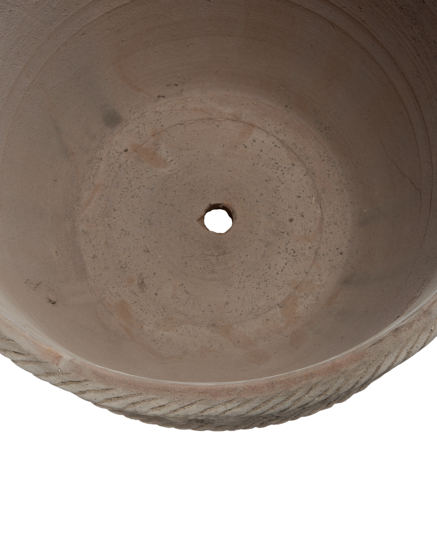 Espalier Basket Pot bottom, showing drainage hole and weathered detailed rim texture.