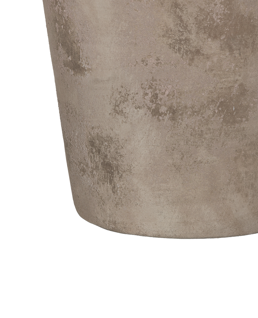 Close-up of the Entwine pot's textured concrete surface, showing distressed and uneven finish.