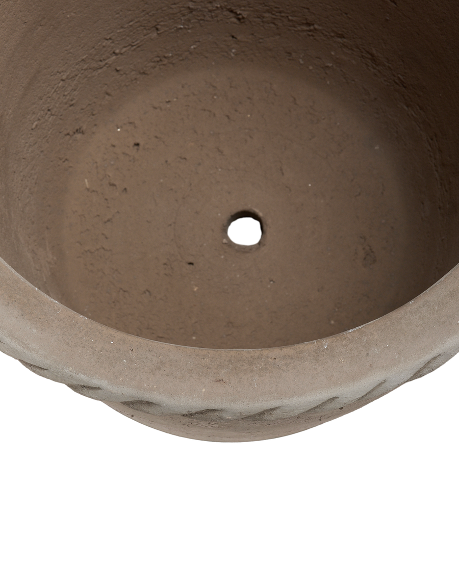 Top-down view of Vietnamese ceramic Entwine Pot interior with rough texture and drainage hole.