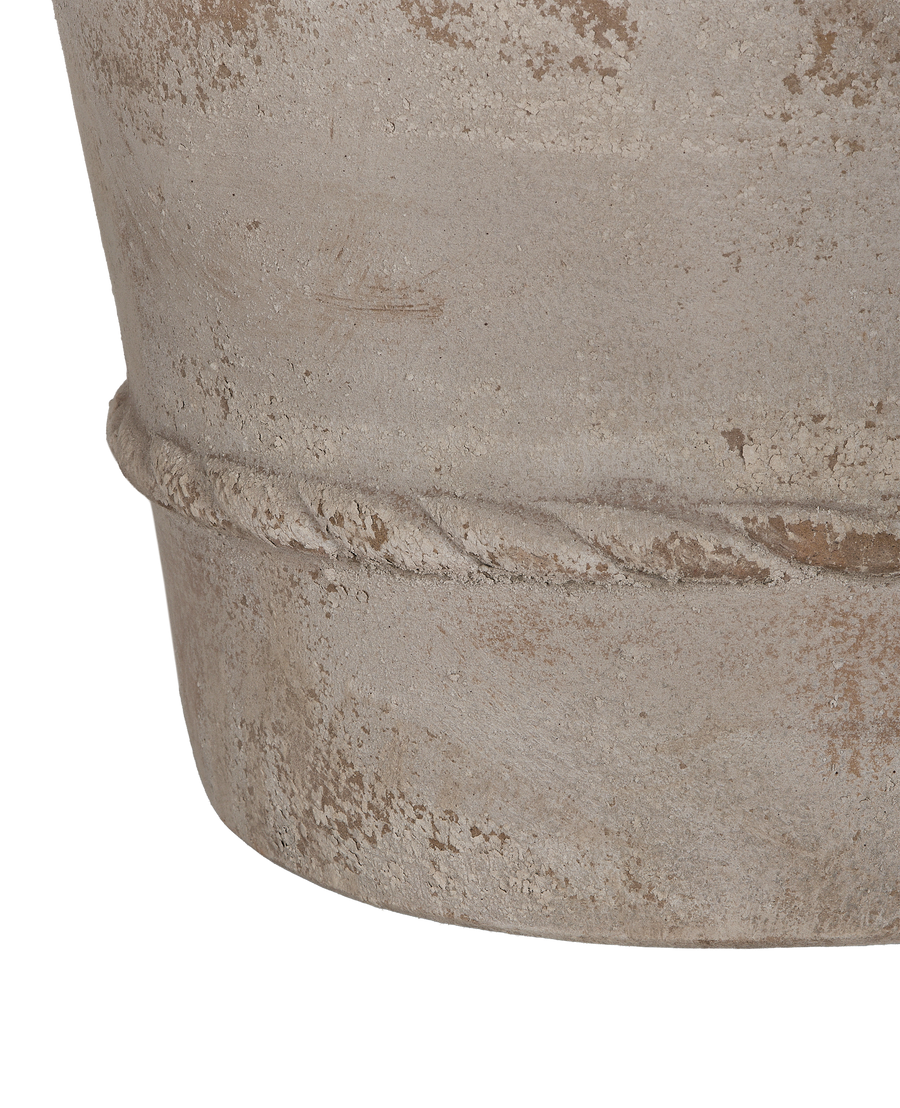 Close-up detail of Cordelia Pot's rough terracotta finish and rustic rope banding.