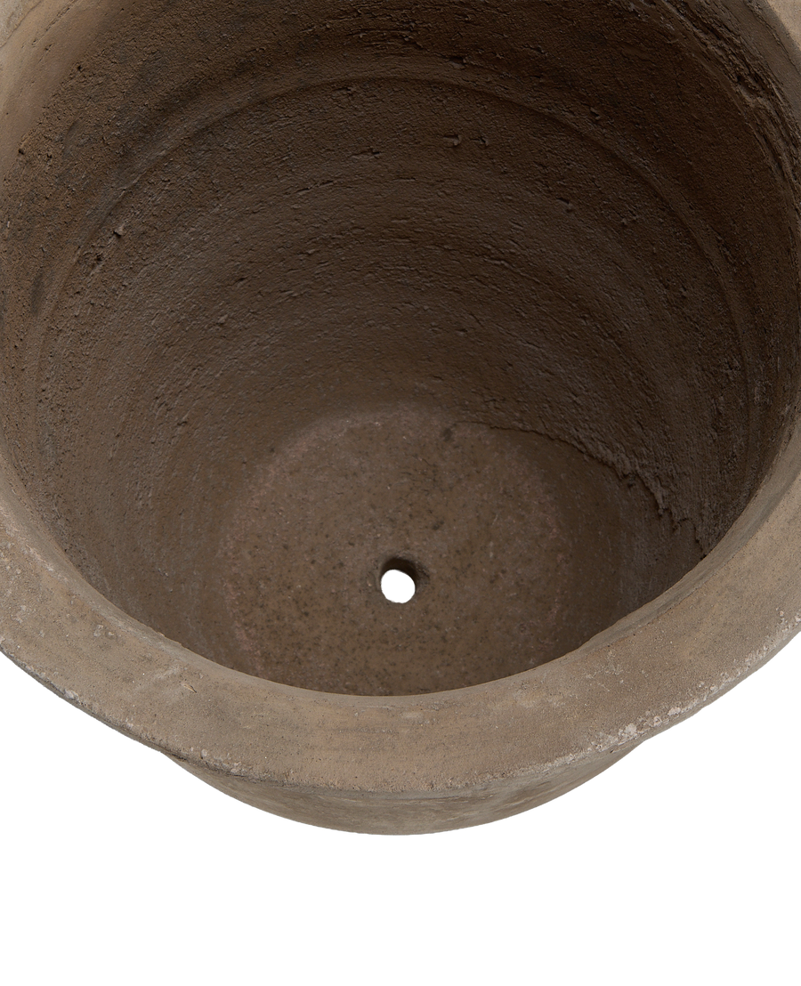 Interior of vintage Vesper Pot, showing rough textured clay and single drain hole.