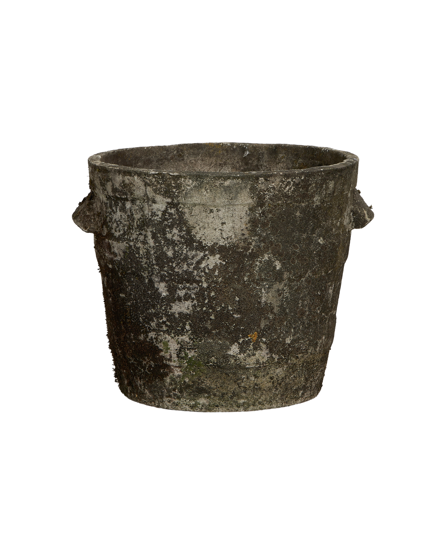 Vintage Willy Guhl fiber cement planter with weathered texture and faint moss.