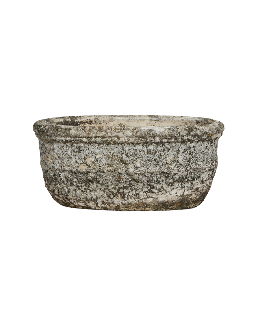 Vintage French oval planter with textured concrete surface and weathered gray patina.