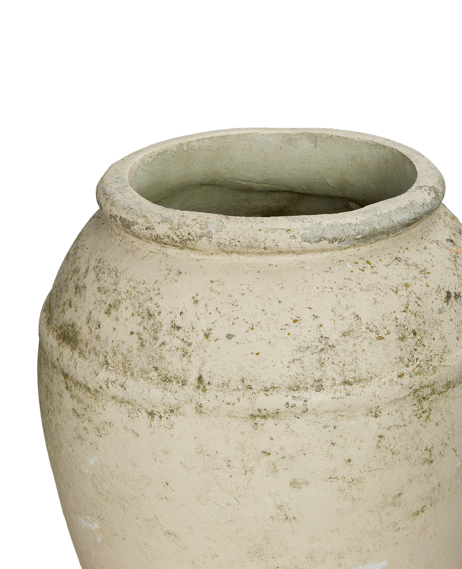 Vintage Willy Guhl conical planter's textured concrete surface, showing weathered details and rim.
