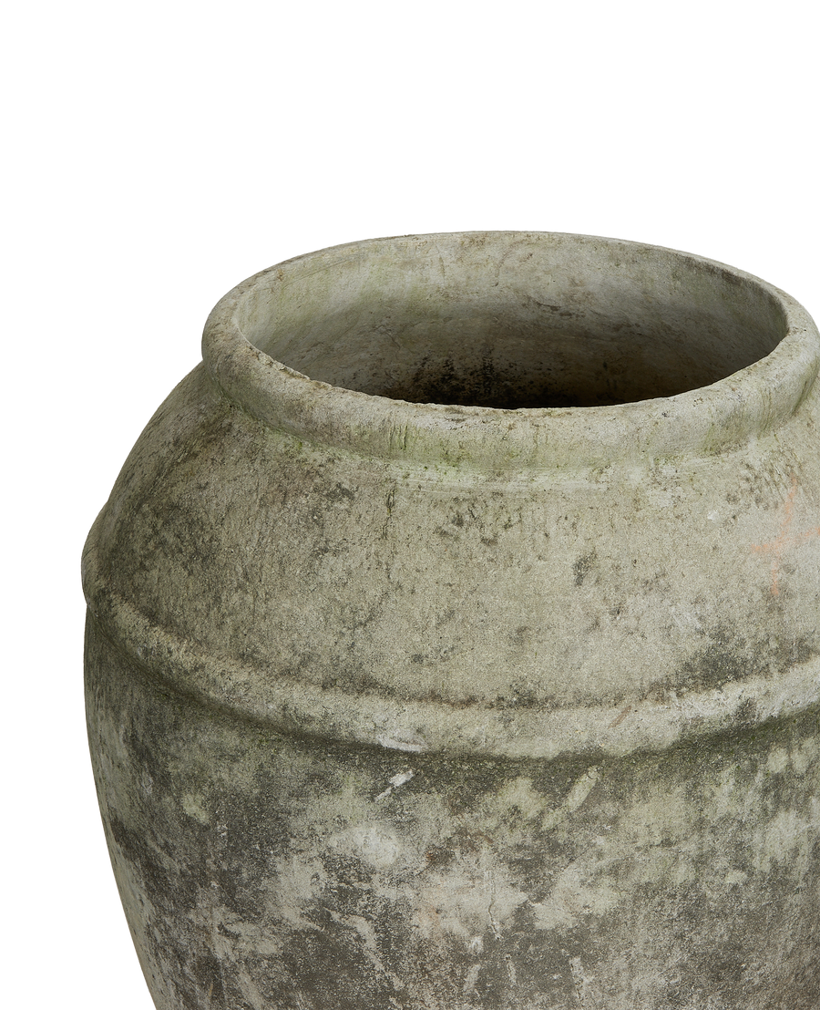 Vintage Willy Guhl concrete planter, close-up showing rim, aged patina, weathered gray texture.