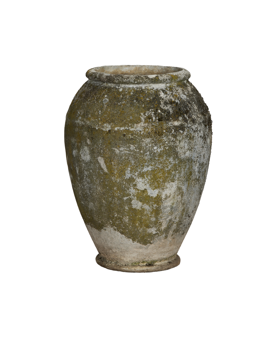 Vintage Willy Guhl jardinere with green moss and white lichen patination, close-up.