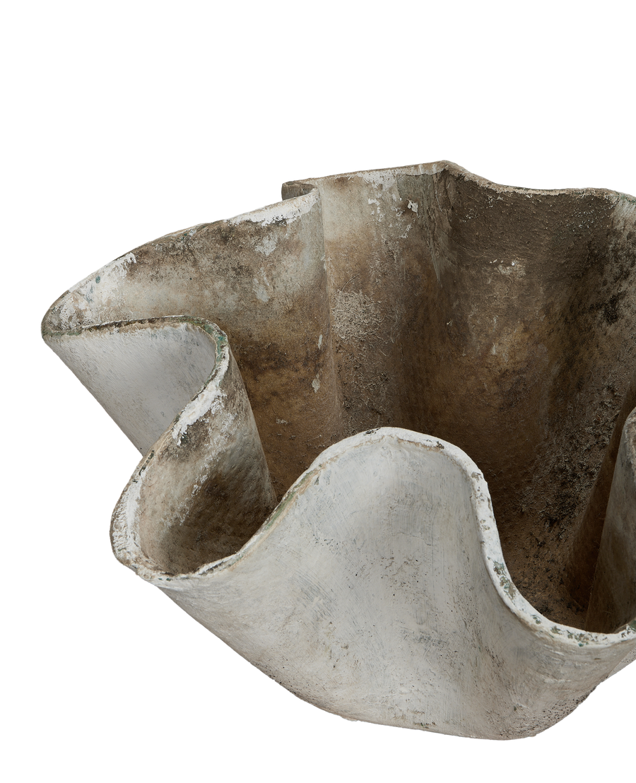Vintage Willy Guhl planter detail, showing organic fiber cement waves and weathered patina.