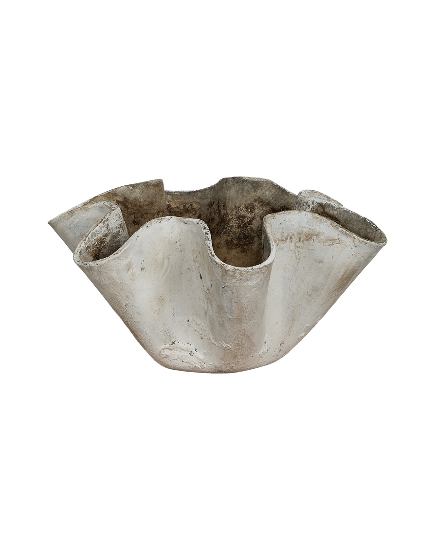 Vintage Willy Guhl planter, close-up of organic undulating concrete texture, Swiss design, showing wear.