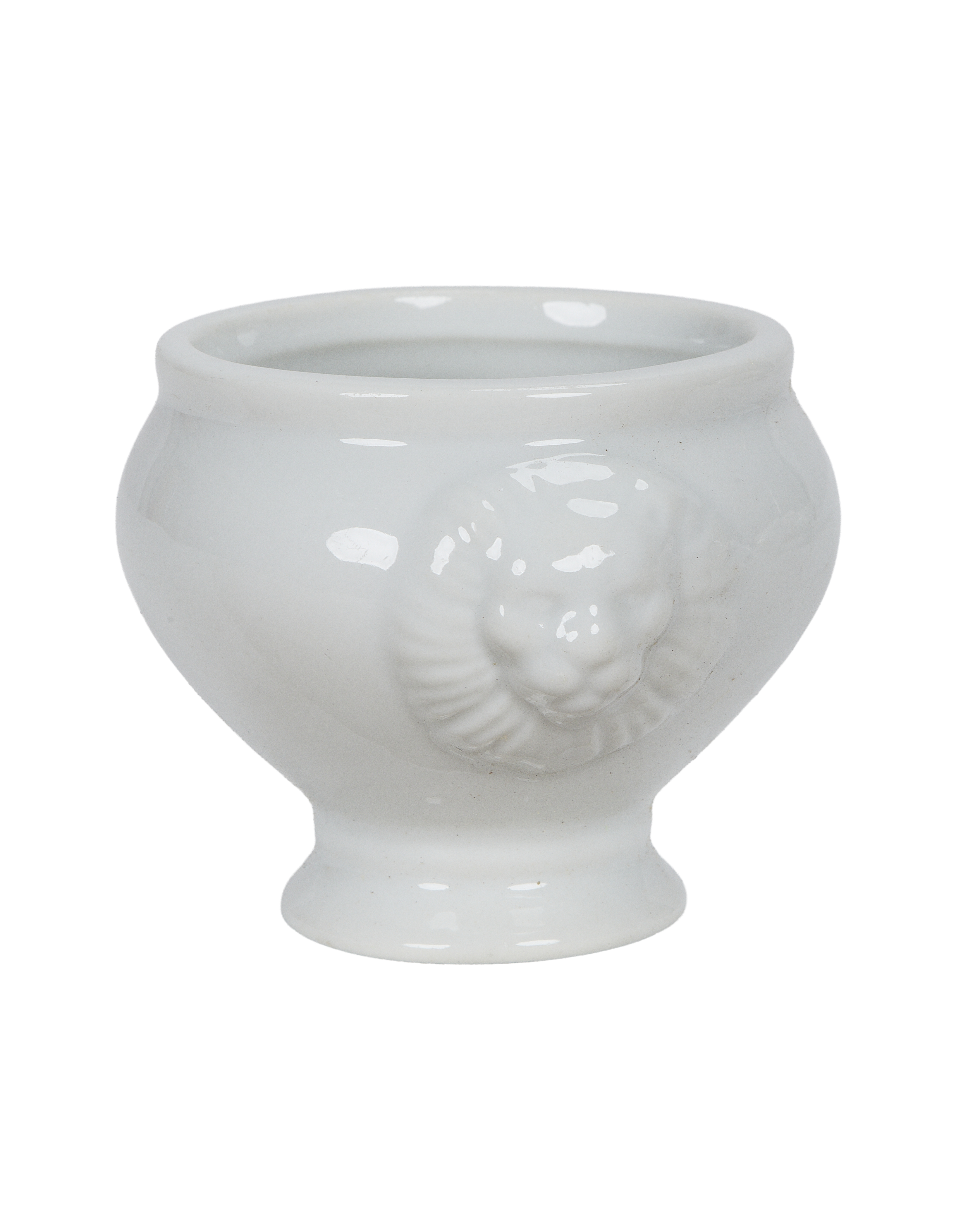 Vintage French white porcelain lion-head salt cellar, bulk, with detailed relief.