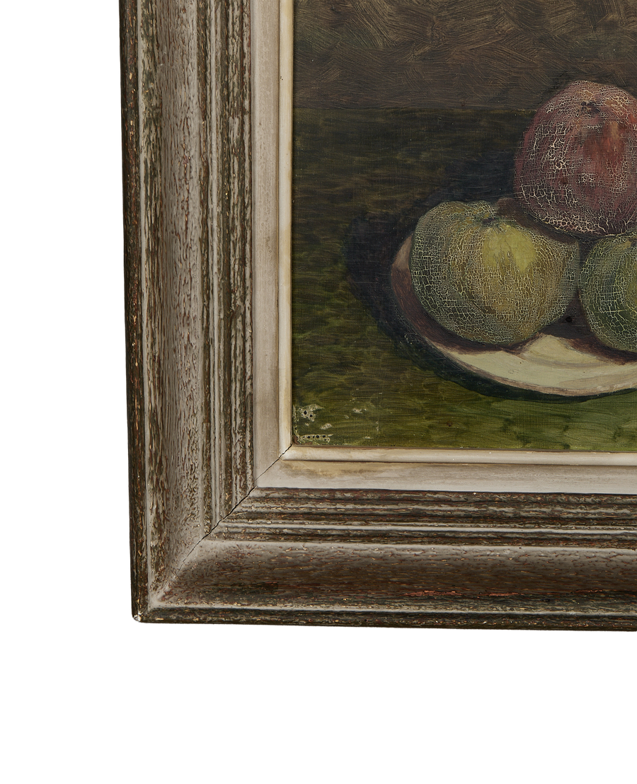 Corner of vintage French oak framed still life painting, showing distressed golden wood.