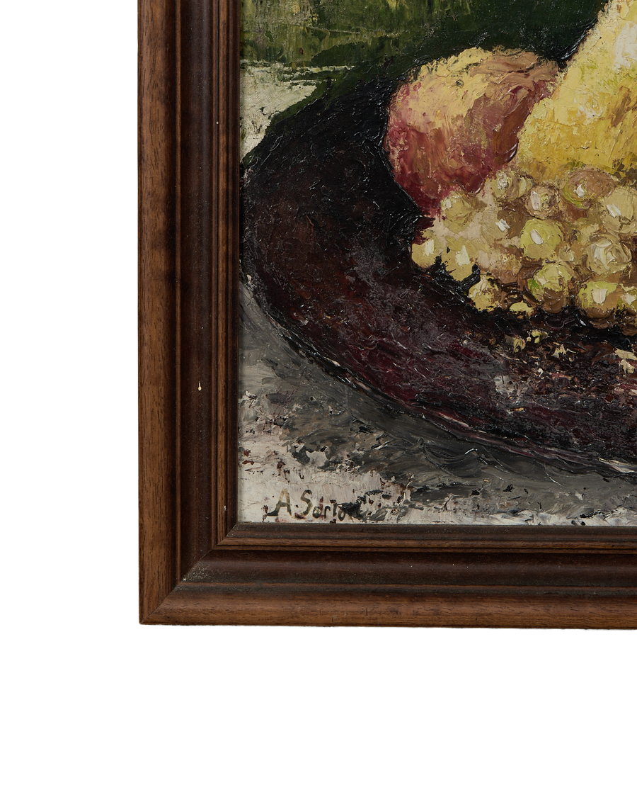 Close-up of vintage French still life oil painting showing artist's signature within oak frame.