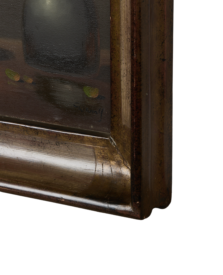 Vintage French still life painting's distressed oak frame with gold accents and aged patina.