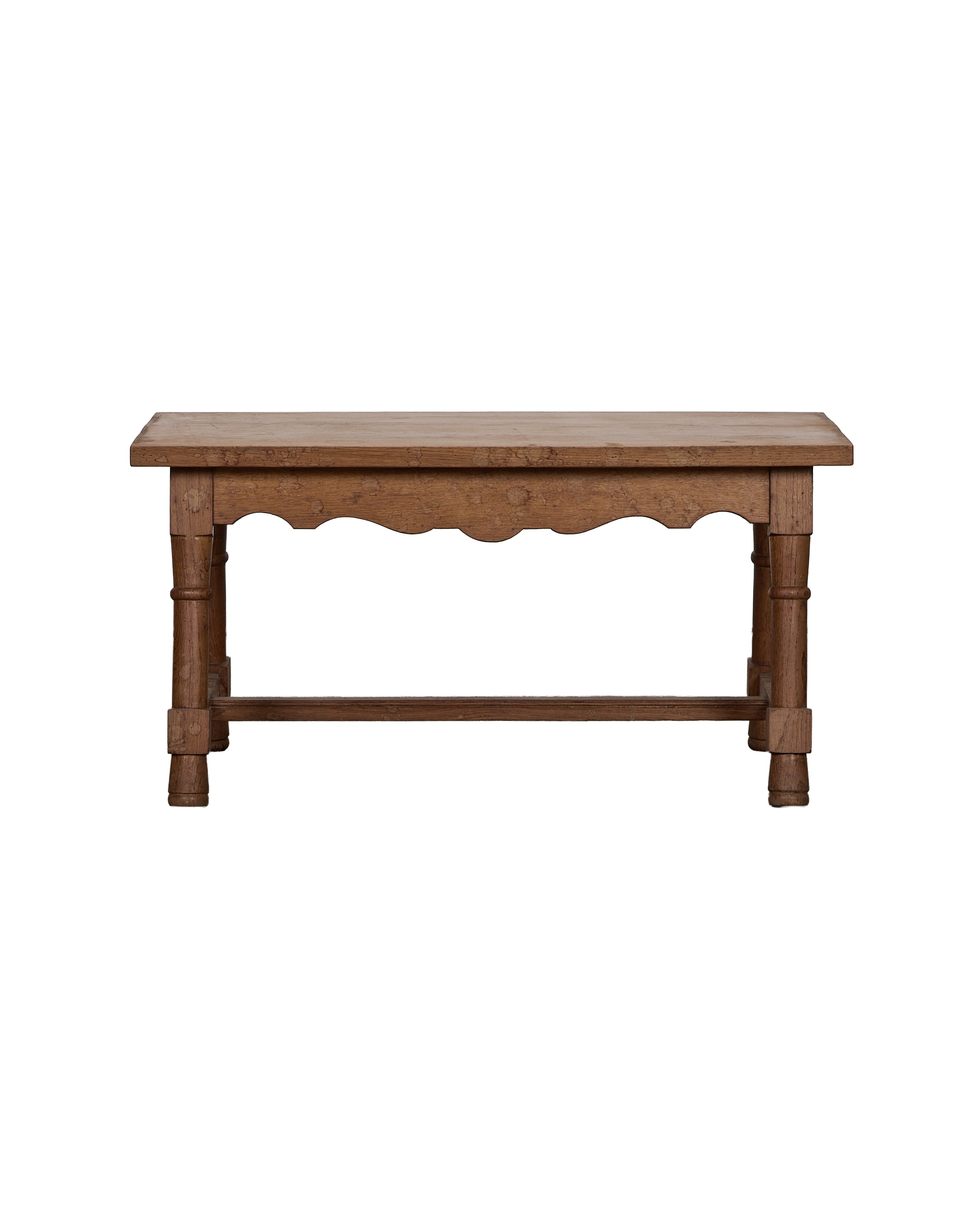 Vintage oak French coffee table, full view of the turned legs and scalloped apron.