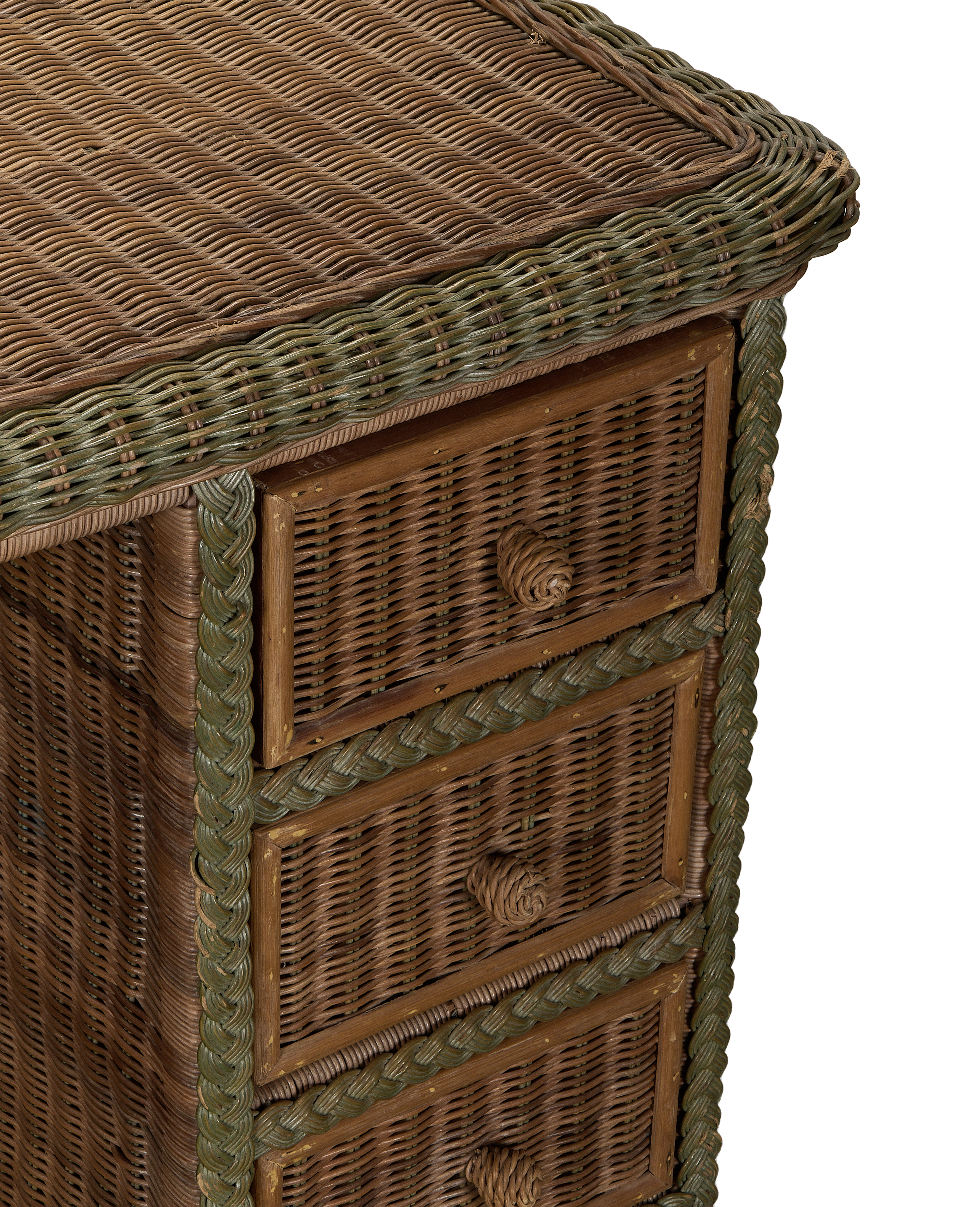 Vintage French rattan desk, close-up of side showing braided green trim, drawers, and aged oak.