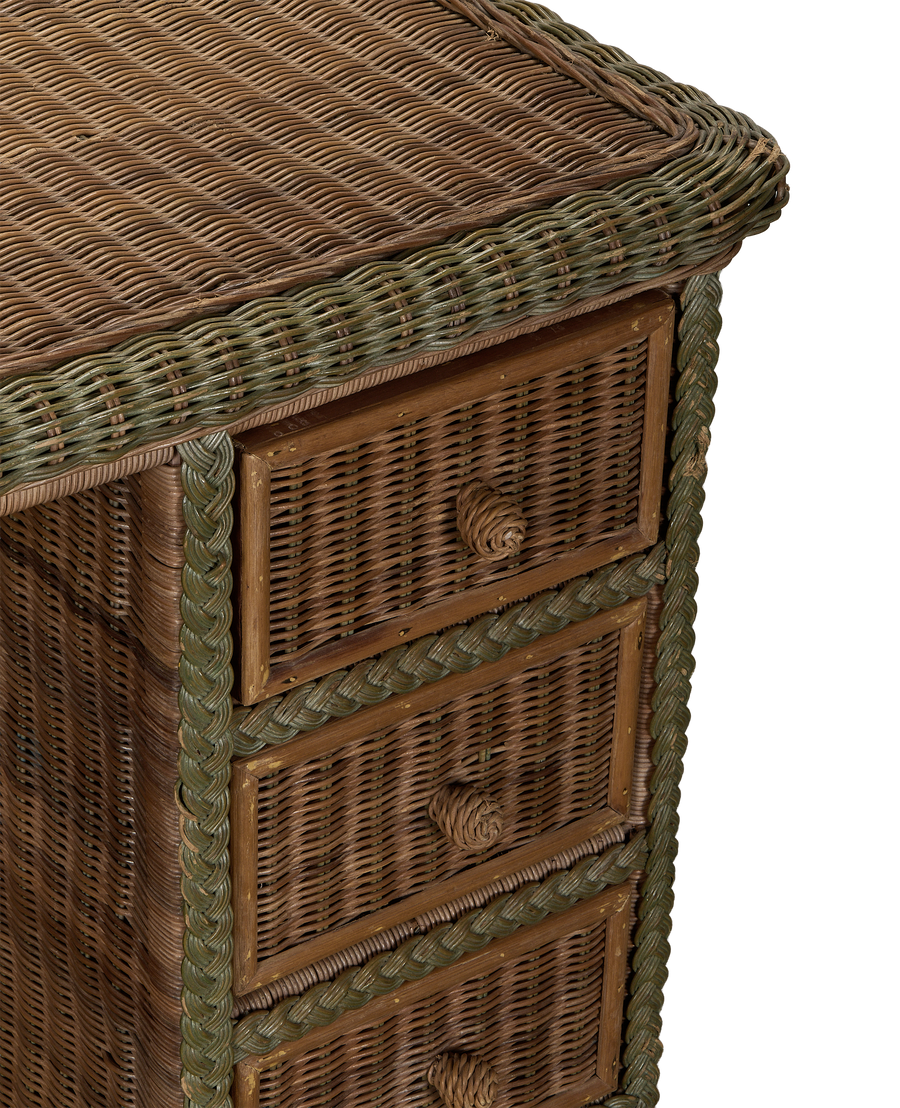 Vintage French rattan desk, close-up of side showing braided green trim, drawers, and aged oak.