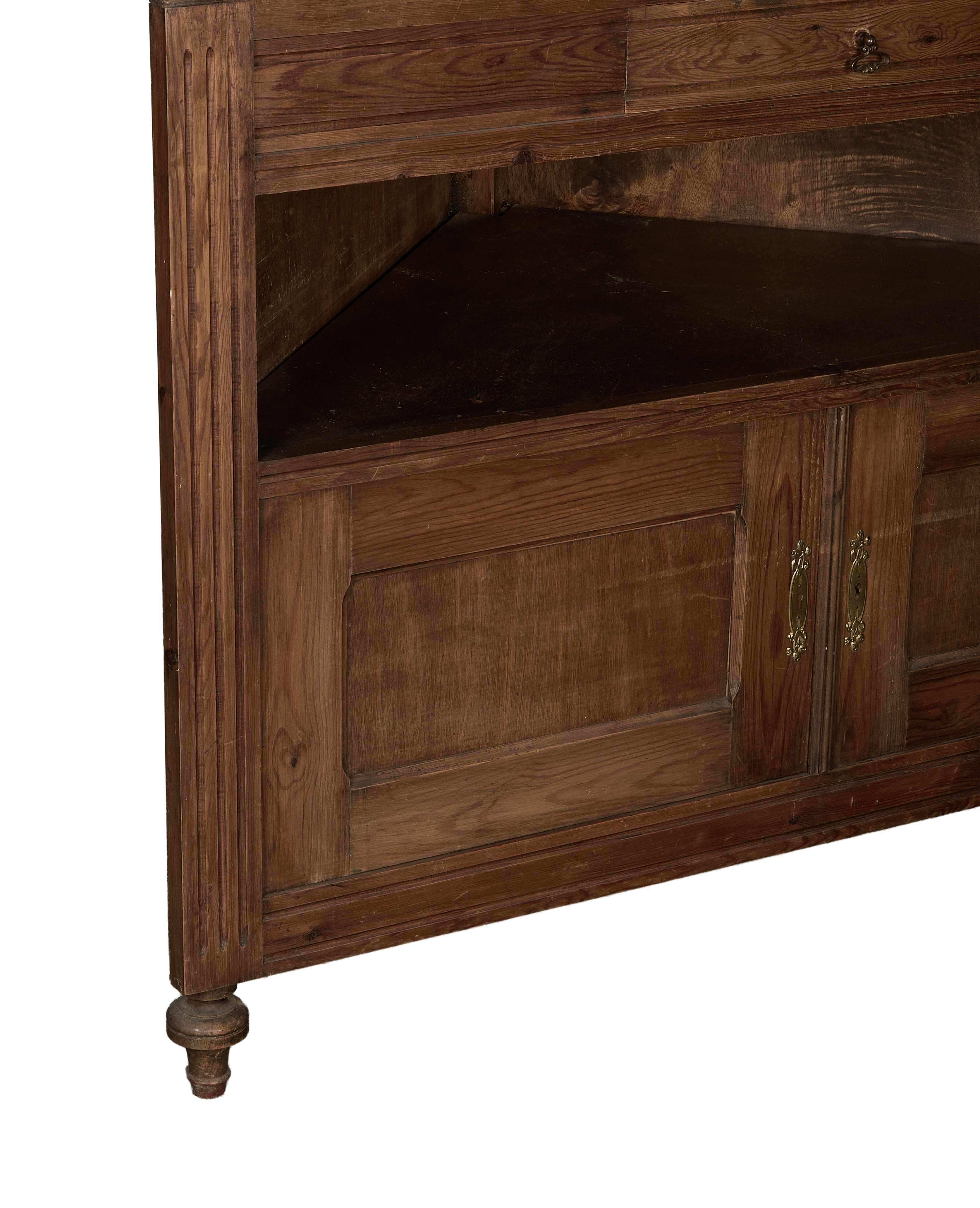 Vintage French oak corner cabinet, showing storage cubby and decorative turned foot.