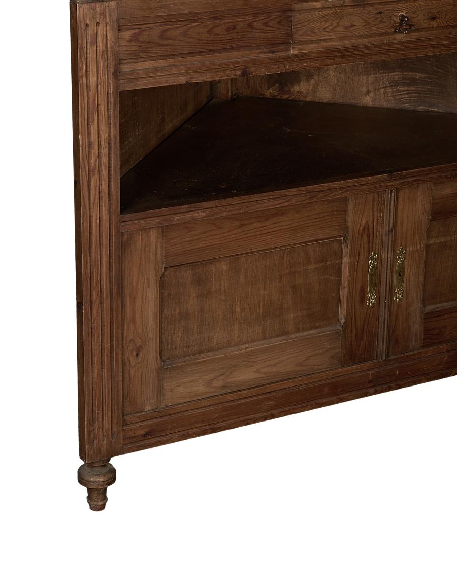 Vintage French oak corner cabinet, showing storage cubby and decorative turned foot.