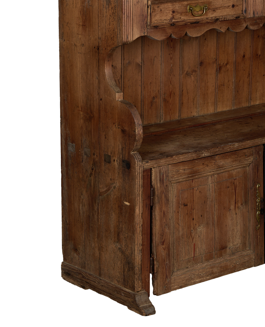 Vintage French oak wood china cabinet, showing lower section with hinged door and decorative trim.