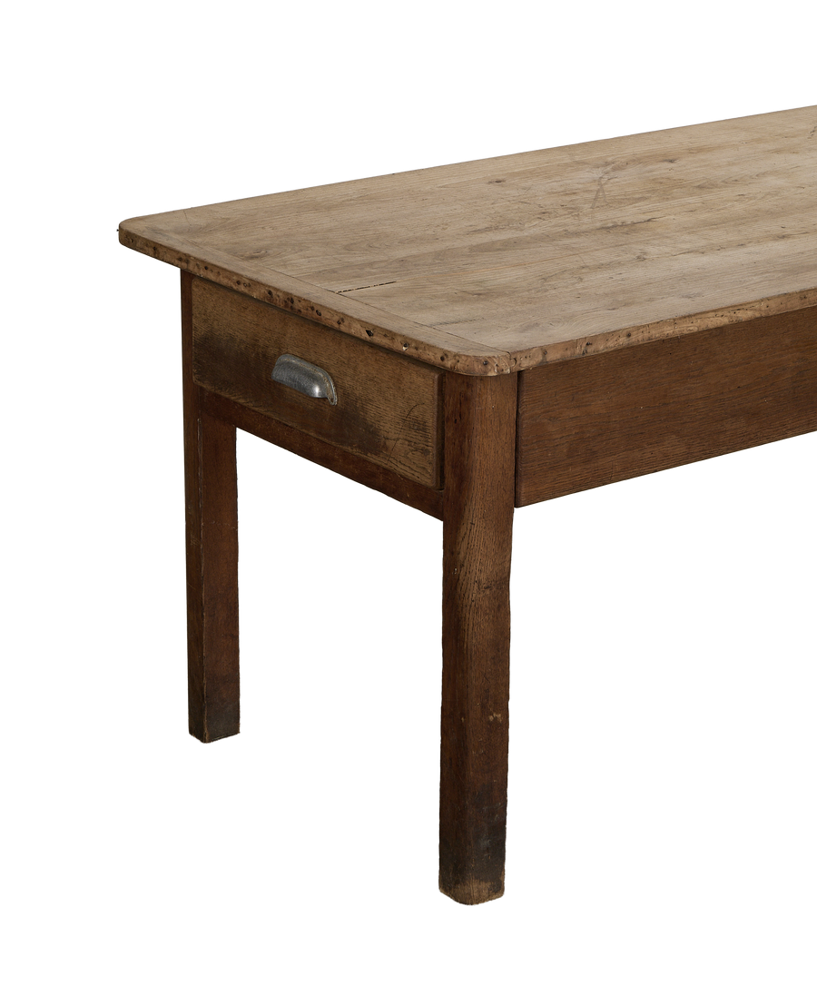 Vintage French oak draper's table, close-up of side drawer with metal handle.