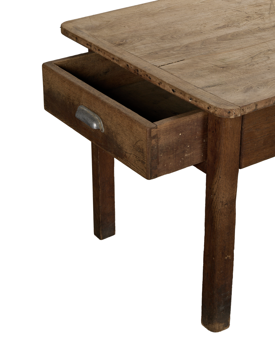 Open drawer detail of vintage French oak draper's table with distressed finish.