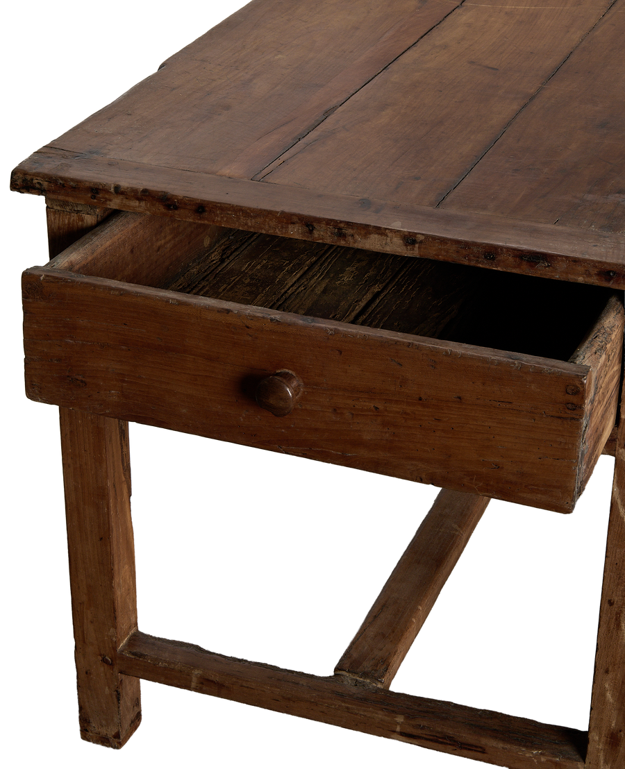 Open drawer of vintage French oak draper's table, showing aged patina.