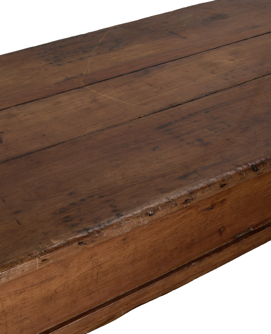 Vintage French oak draper's table surface with visible wood grain and distressed patina.